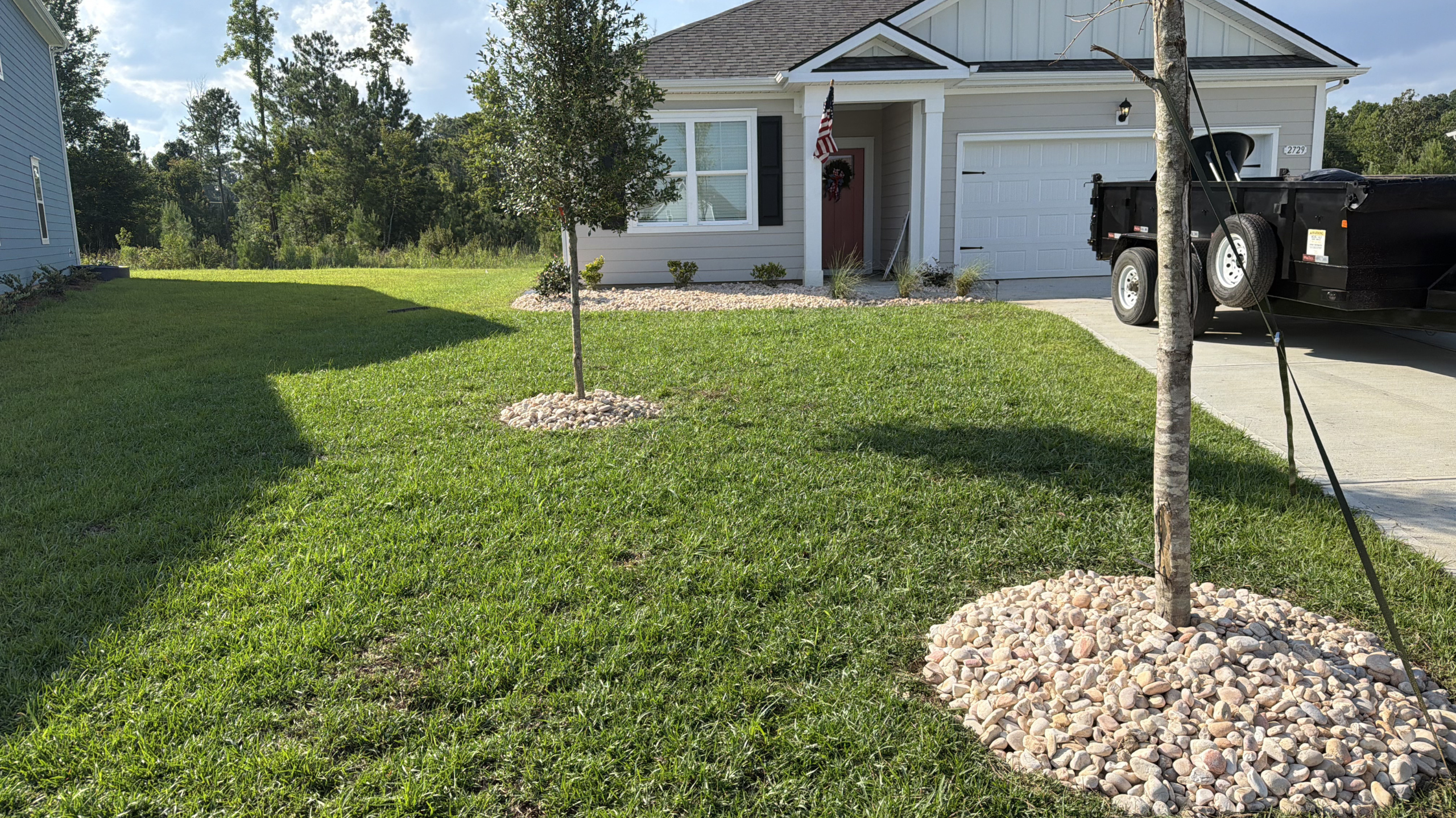 New Construction Lawn & River Rock Tree Rings